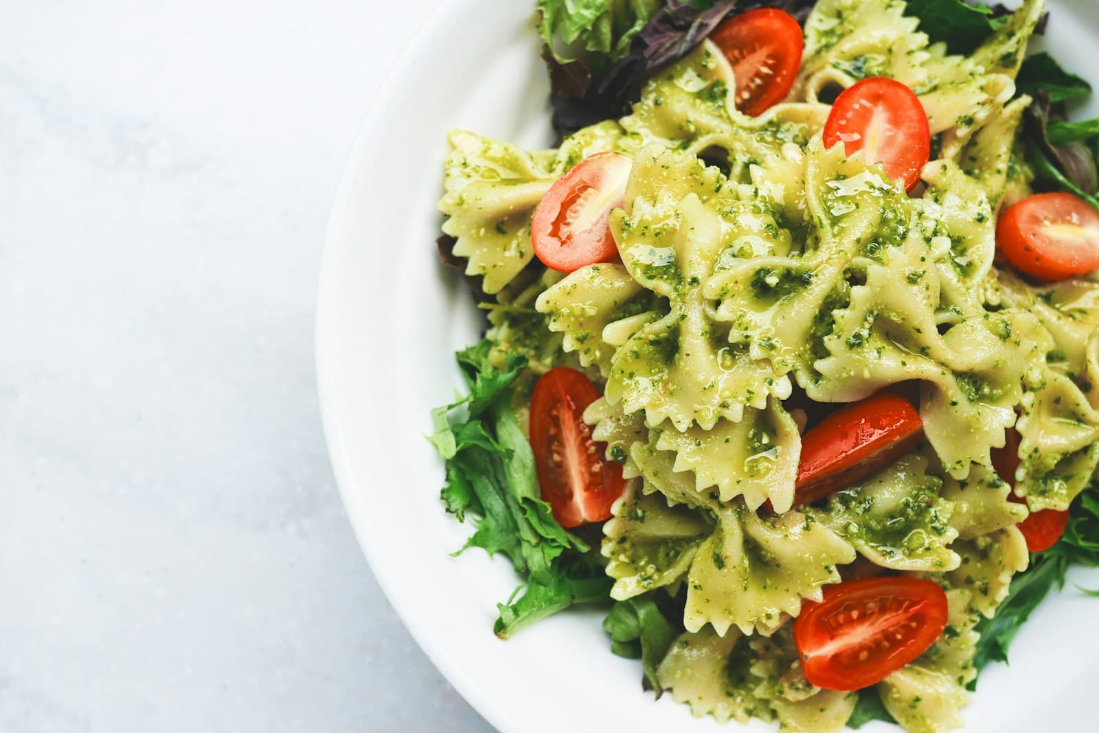 Bowtie pasta with pesto and tomatoes