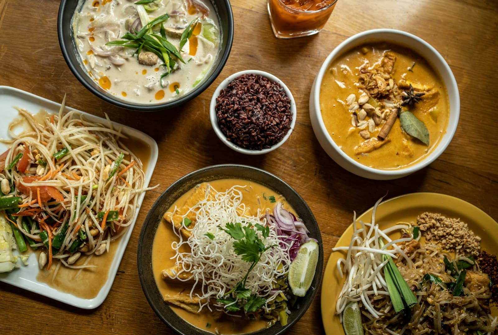 A spread of Thai curries, noodles and papaya salad